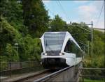 The Thurbo GTW RABe 526 777-8 is running on the bridge over the Rhine falls in Neuhausen am Rheinfall on September 13th, 2012.